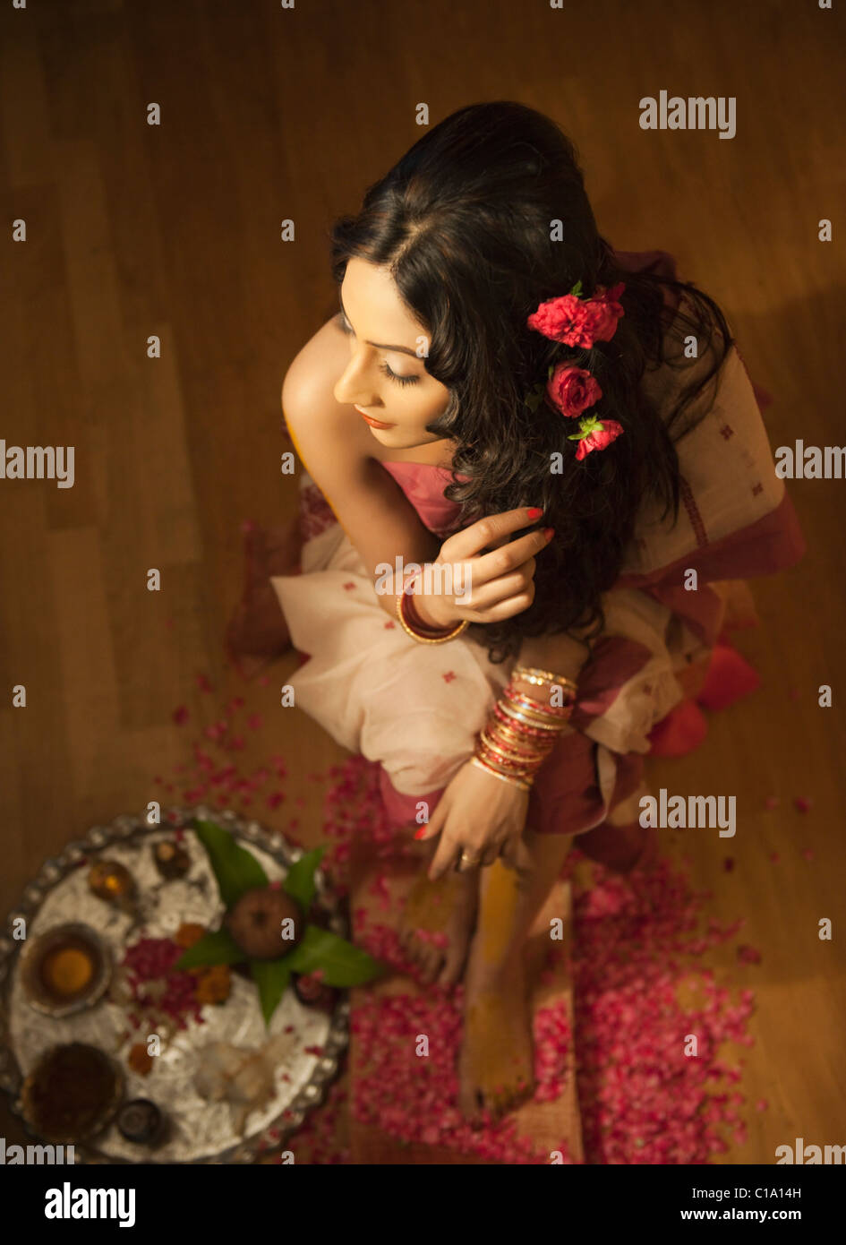 High angle view of a bride in traditional Bengali dress with pooja thali Stock Photo