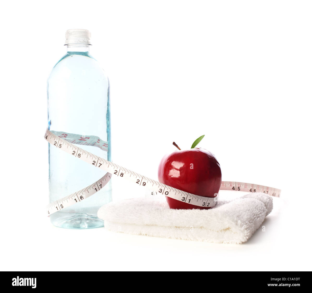 Water bottle with apple and measuring tape Stock Photo