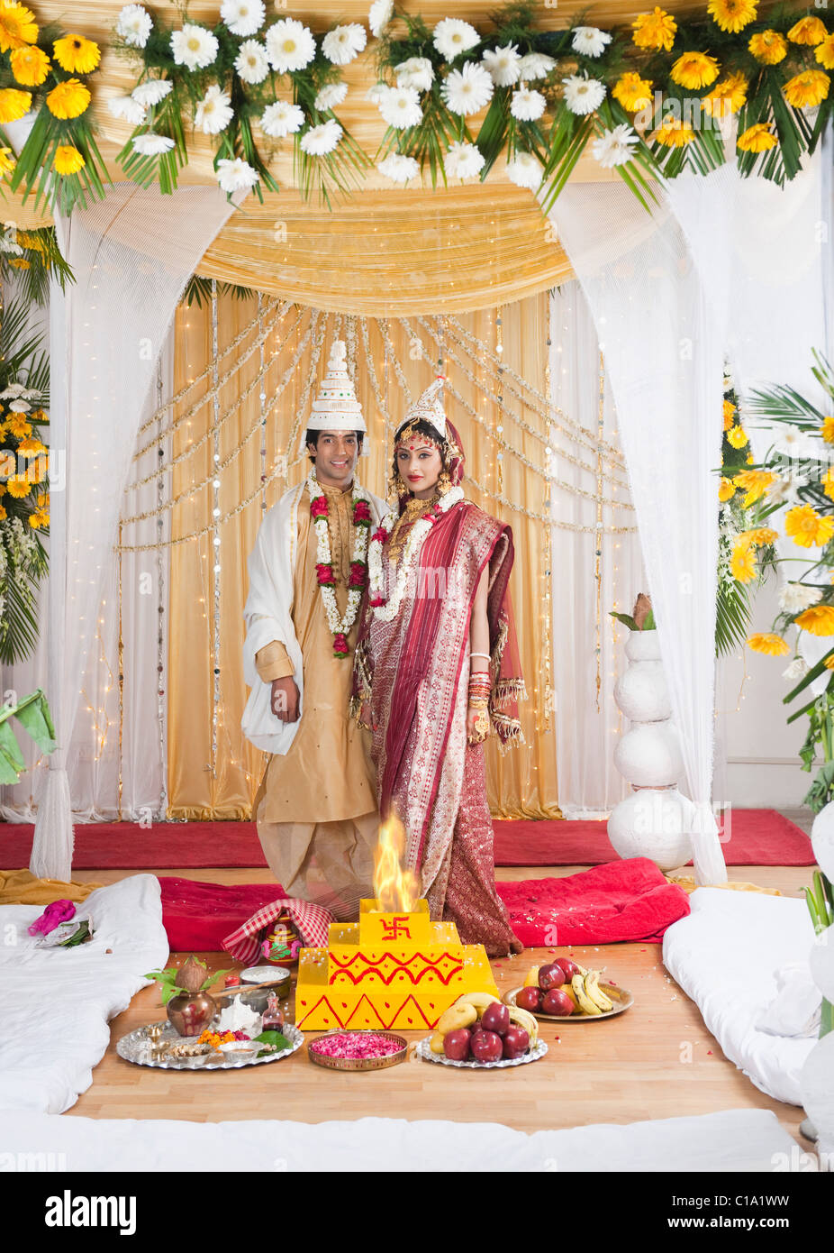 Portrait Of A Newlywed Couple In Wedding Mandap Stock Photo