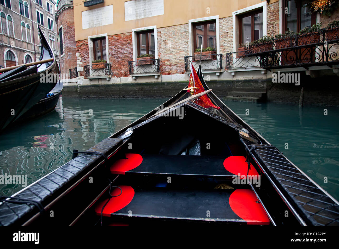 Gondola sailing in Venice channel, Italy Stock Photo - Alamy