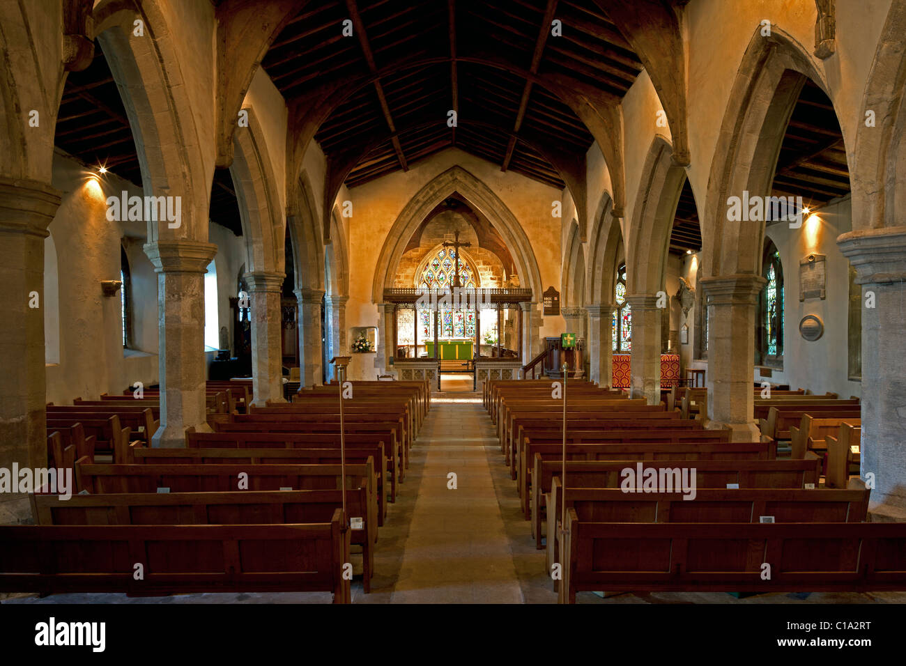 The Nave, looking towards the altar and the Jesse Window (stained glass) at St Mary's Church in