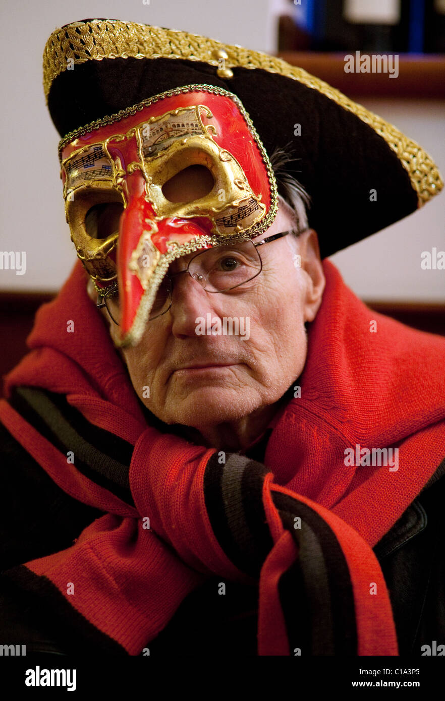 An elderly man in carnival costume and mask, the Venice carnival, Venice, Italy Stock Photo