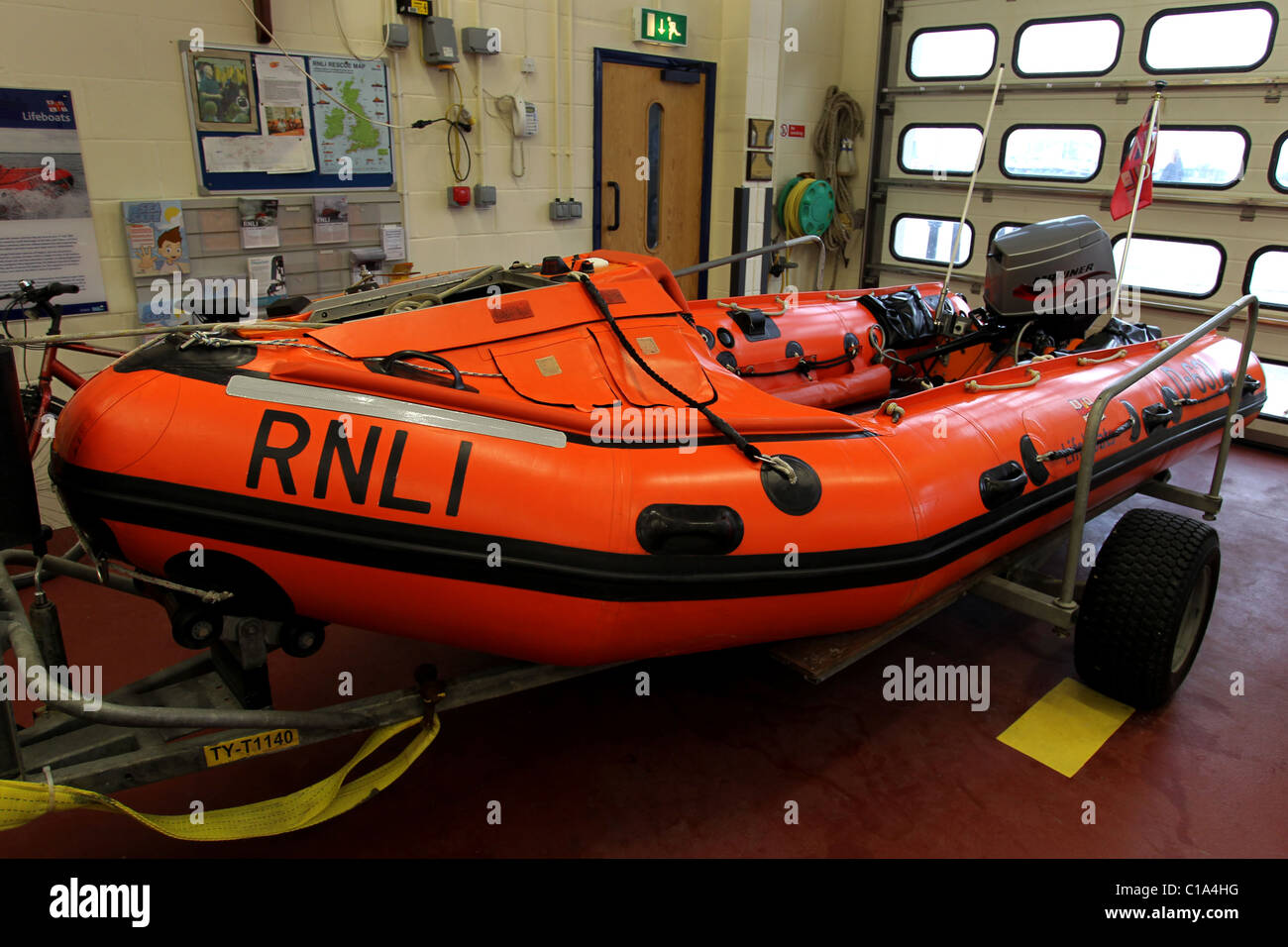 RNLI Lifeboat pictured on its trailer in a Lifeboat station in Littlehampton, West Sussex, UK. Stock Photo