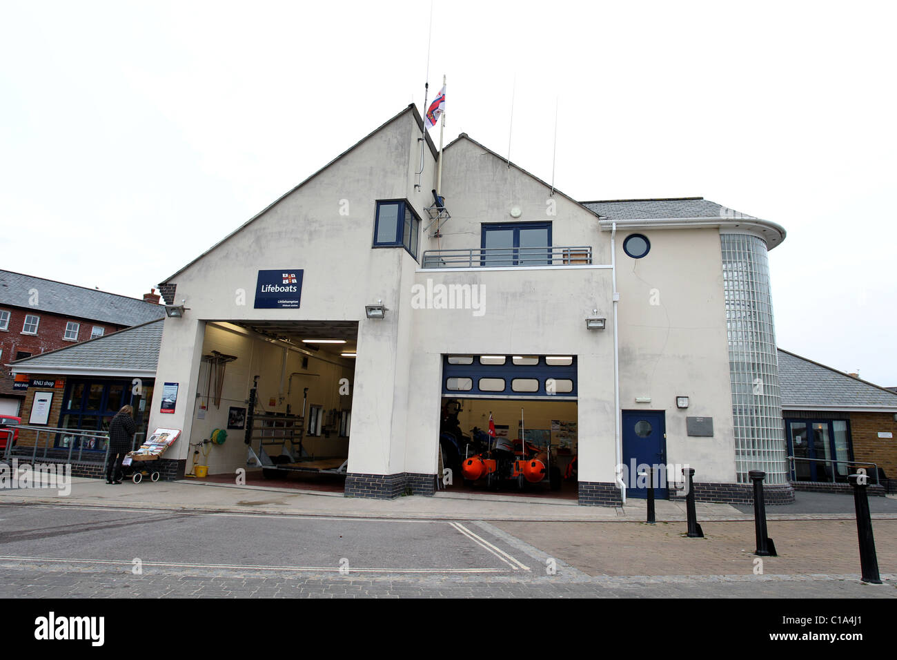 RNLI Lifeboat pictured on its trailer in a Lifeboat station in Littlehampton, West Sussex, UK. Stock Photo