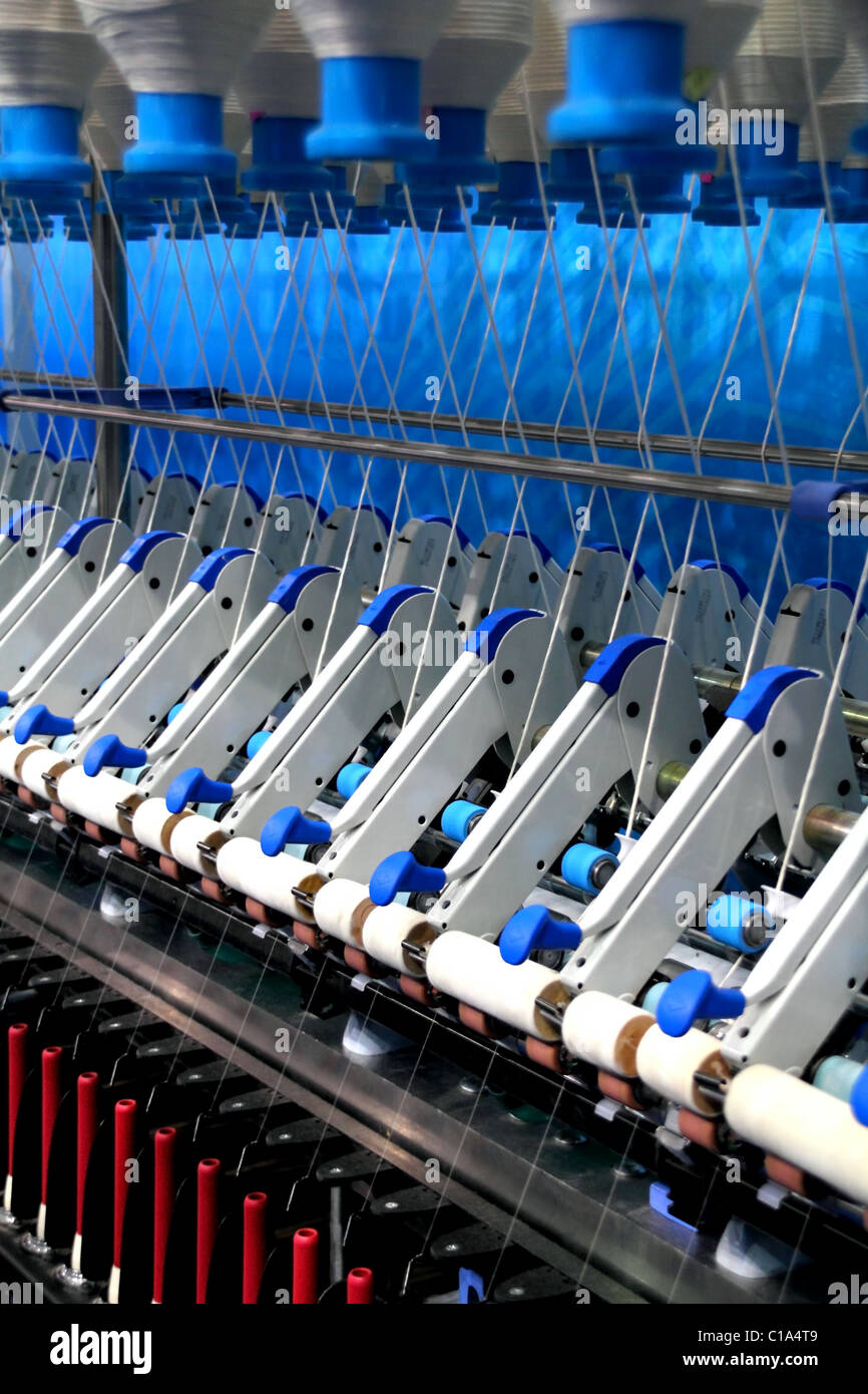 Cotton yarn production in a textile factory Stock Photo