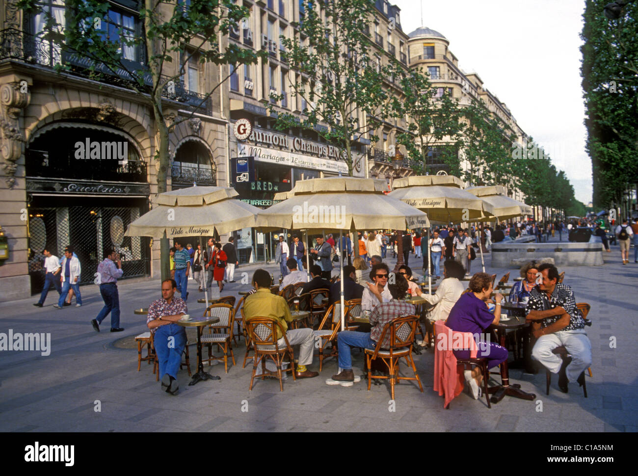 people, eating, sidewalk cafe, French restaurant, French food and drink, food and drink, Avenue des Champs-Elysees, Paris, Ile-de-France, France Stock Photo