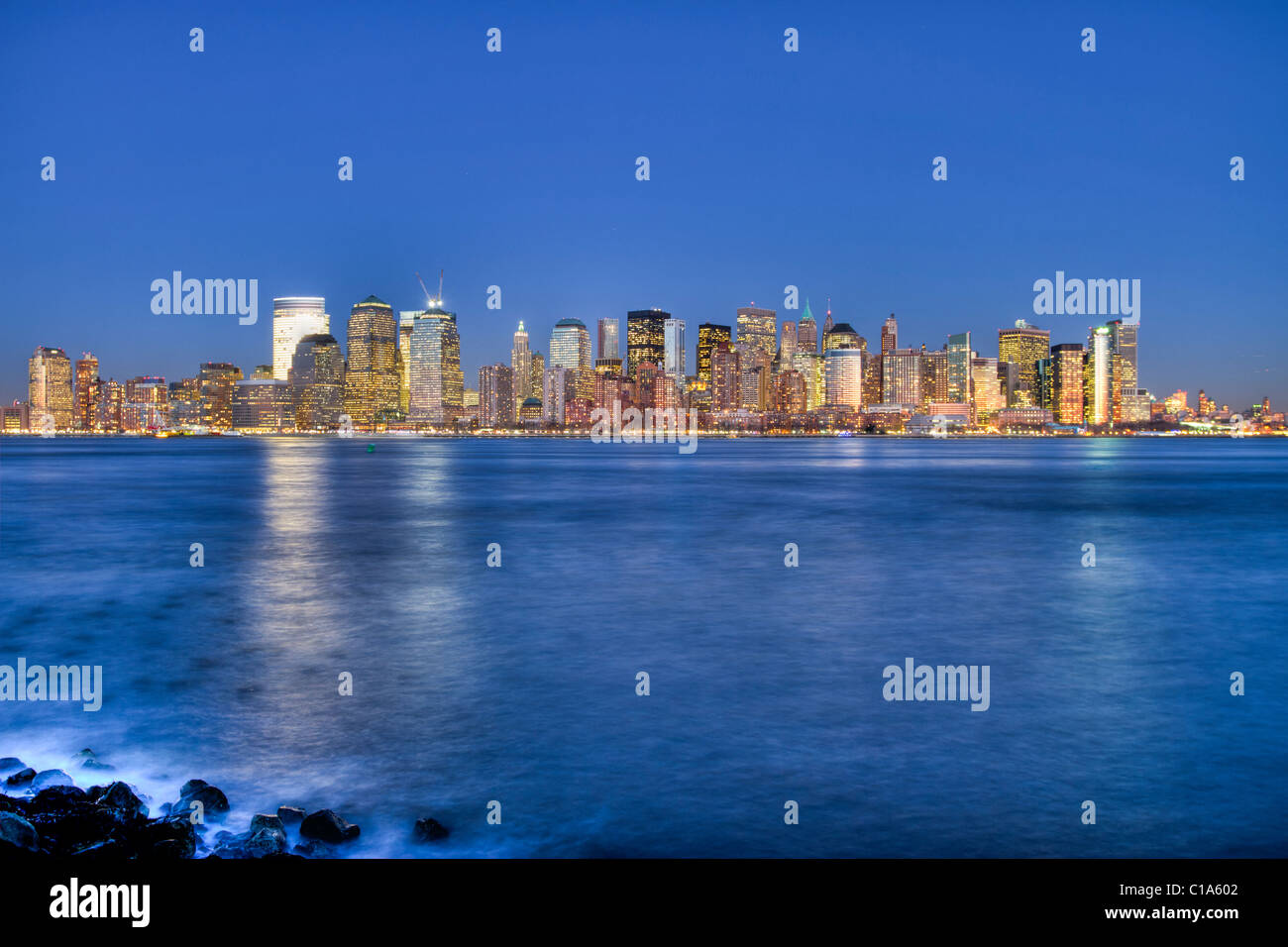 Skyline of lower Manhattan across the Hudson River at twilight seen from Liberty State Park in New Jersey Stock Photo
