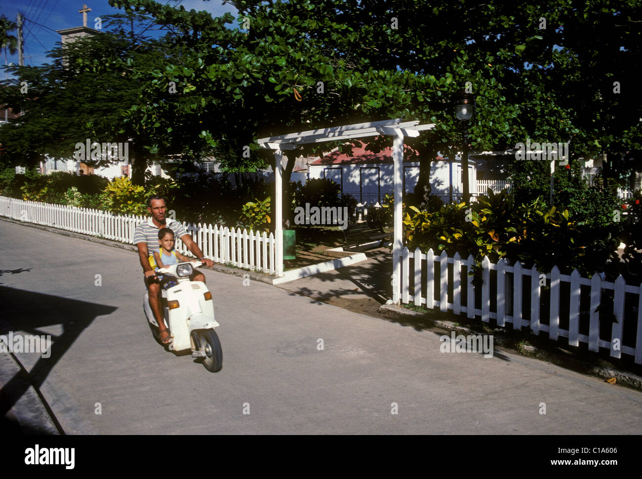French man, French girl, father and daughter, riding motor scooter