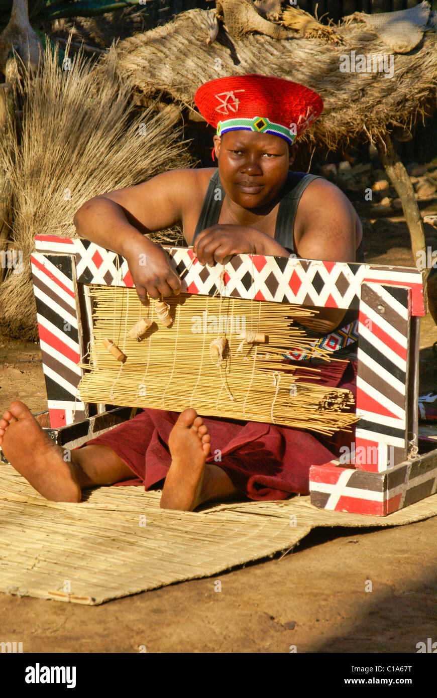 Zulu woman weaving reed mat, Shakaland, South Africa Stock Photo Alamy