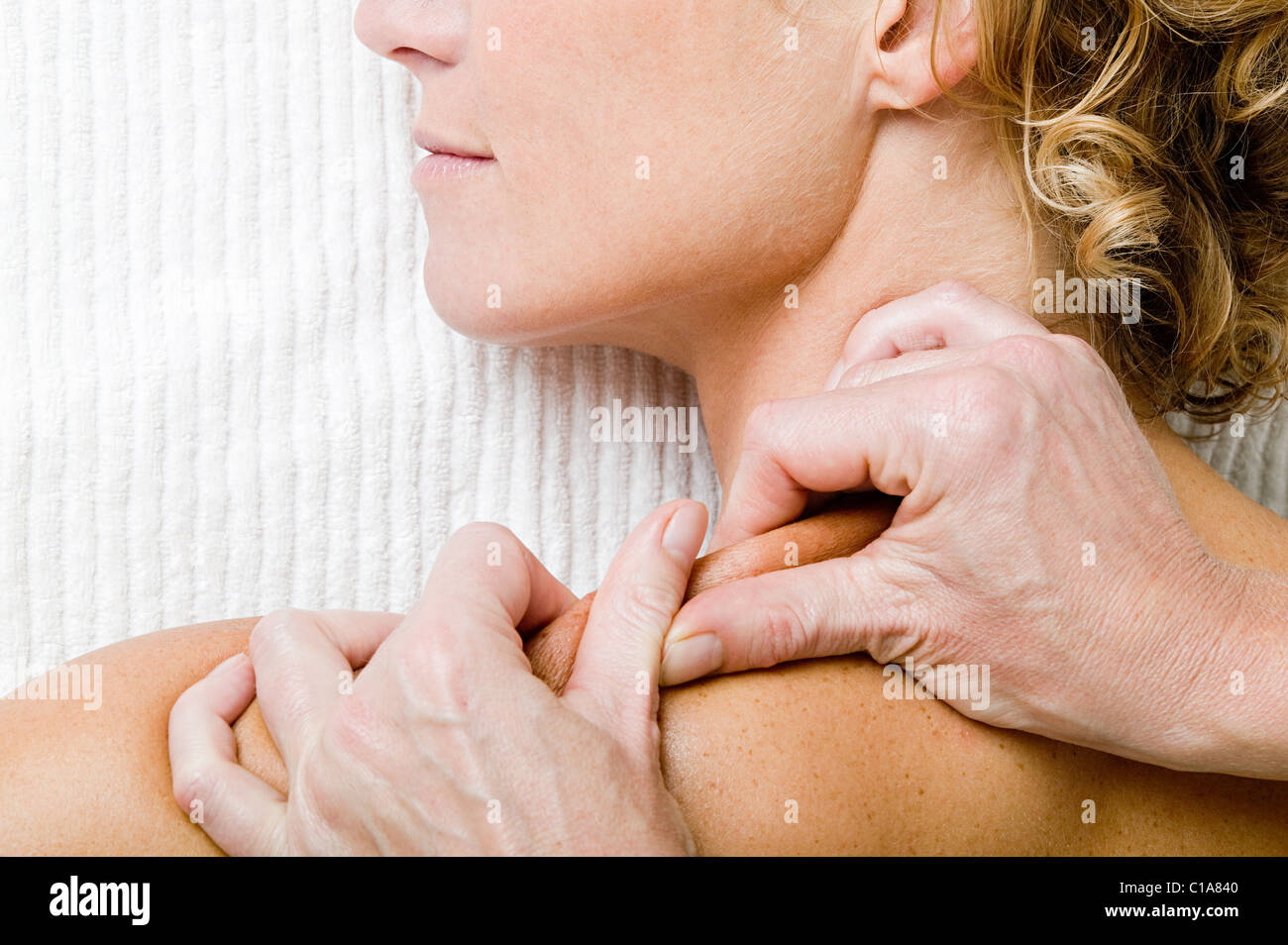 Woman having shoulder massage Stock Photo