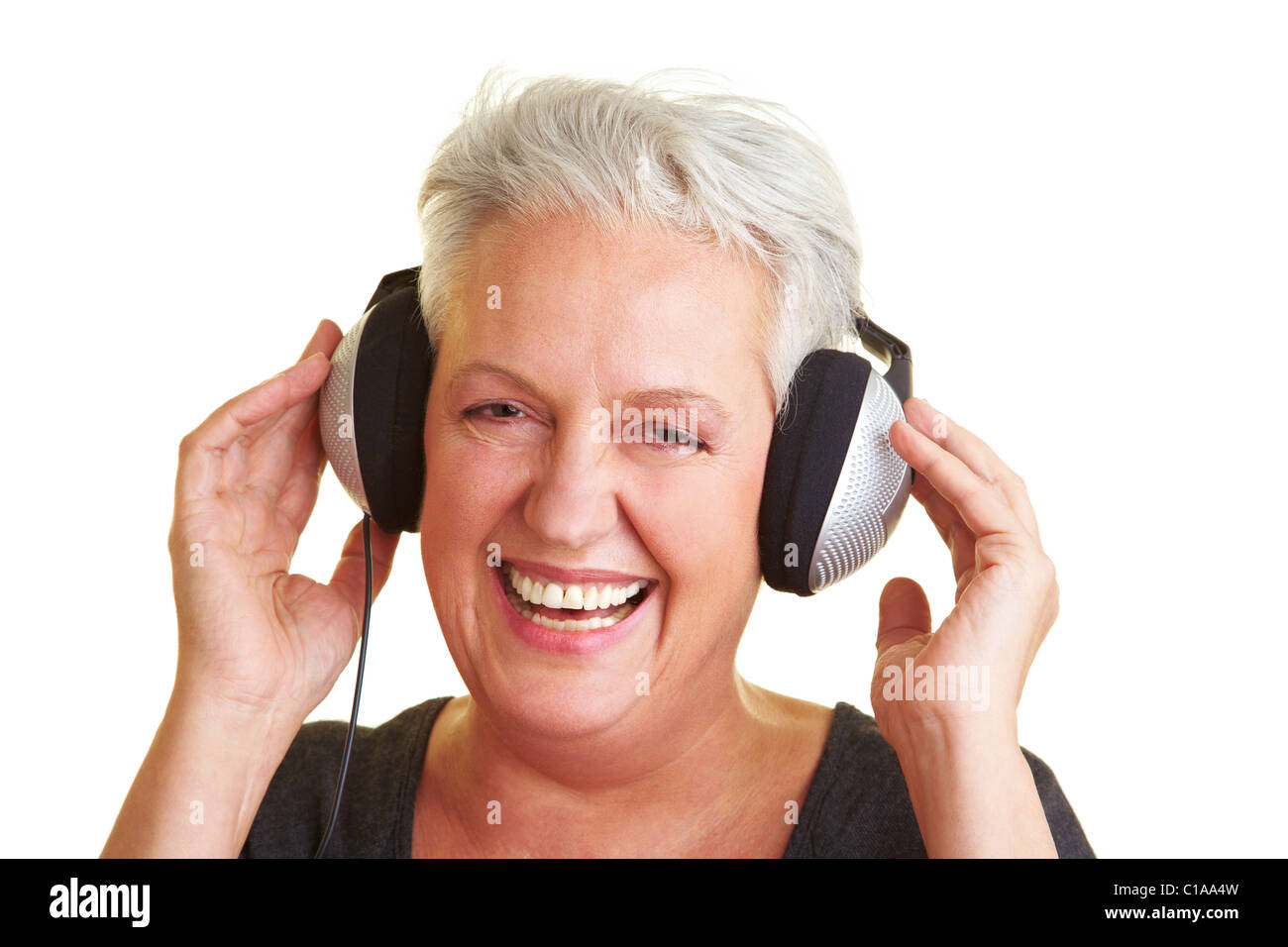 Senior Woman listening to music Stock Photo