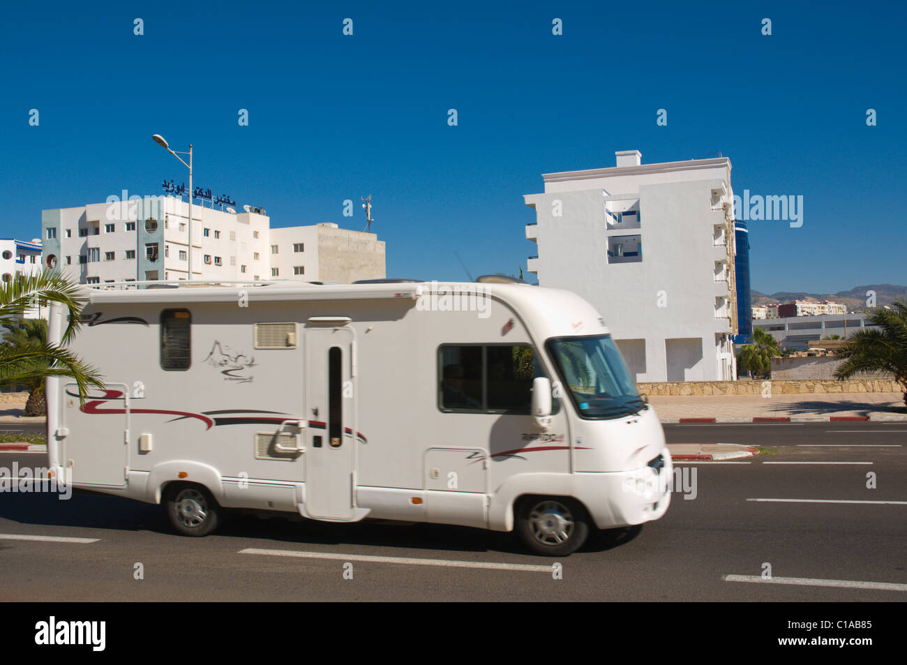 Moving campervan along Avenue Mohammed V street Agadir the Souss southern Morocco northwestern Africa Stock Photo