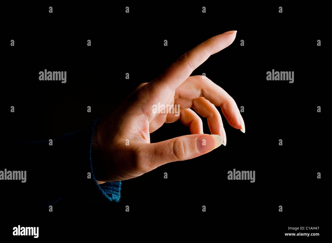 female hand pointing or touching gesture Stock Photo