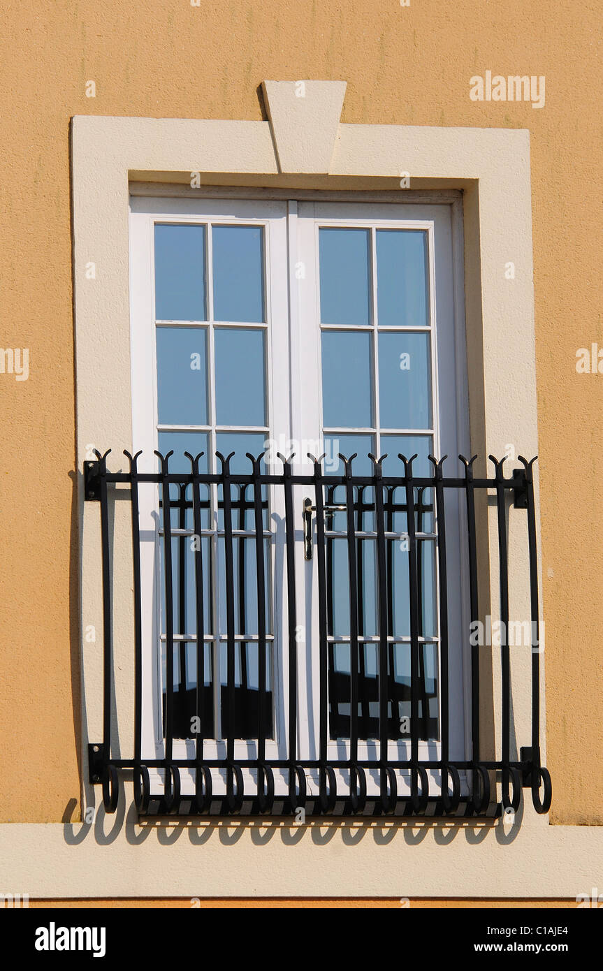 French doors and railings on a building in the new development of Poundbury Village, Dorchester, Dorset Stock Photo