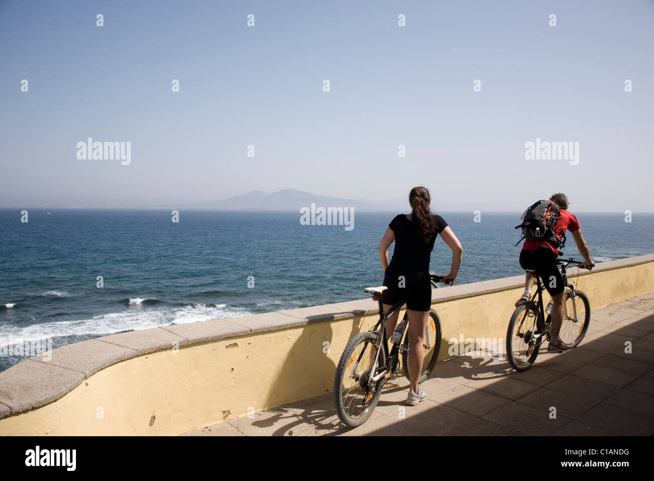 Spain  Fuerteventura Isla de los Lobos Cyclists Stock Photo