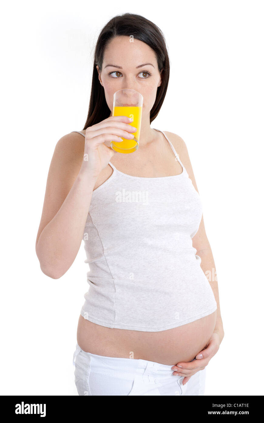 Pregnant woman drinking glass of orange juice Stock Photo Alamy