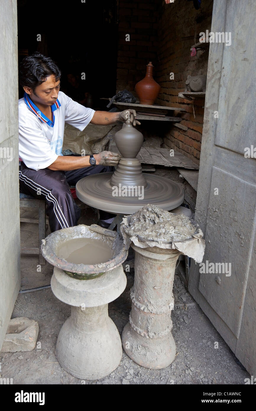 Potter throwing a pot on wheel, Potters Square, Bhaktapur, UNESCO World