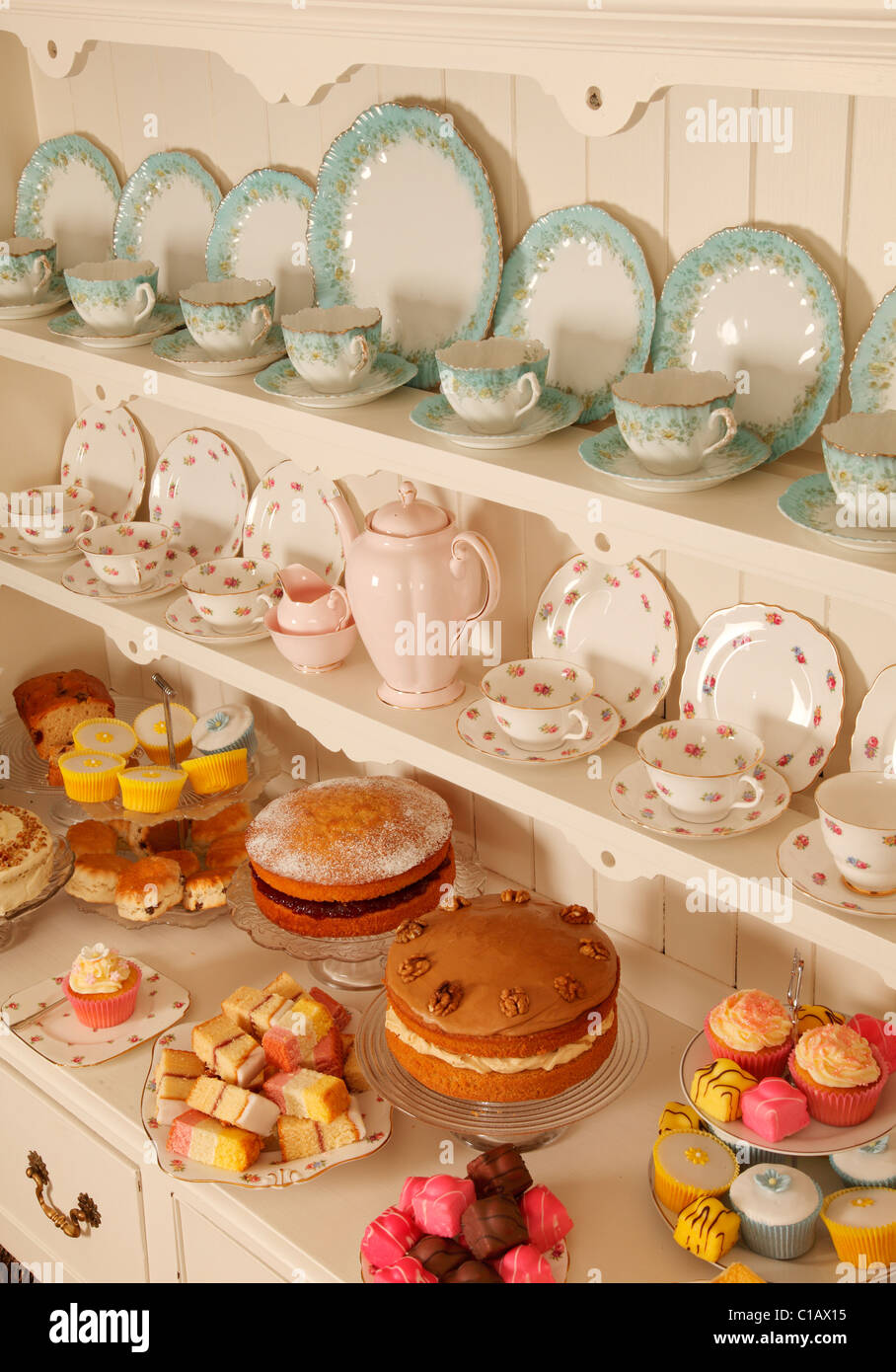 VINTAGE CHINA TEACUPS WITH CAKES Stock Photo