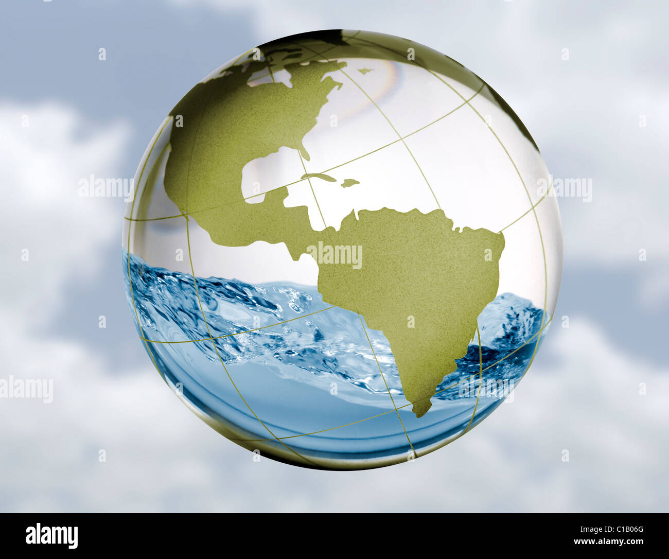 A glass globe with water sloshing around inside in a concept image for fresh water issues such as supply, drought, flooding, etc Stock Photo