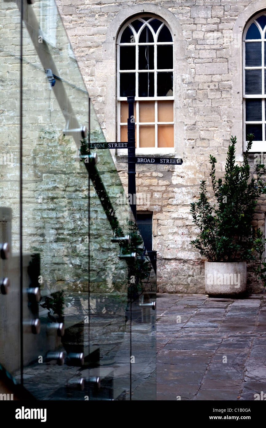 Glass railing with a stone building in the background Stock Photo - Alamy