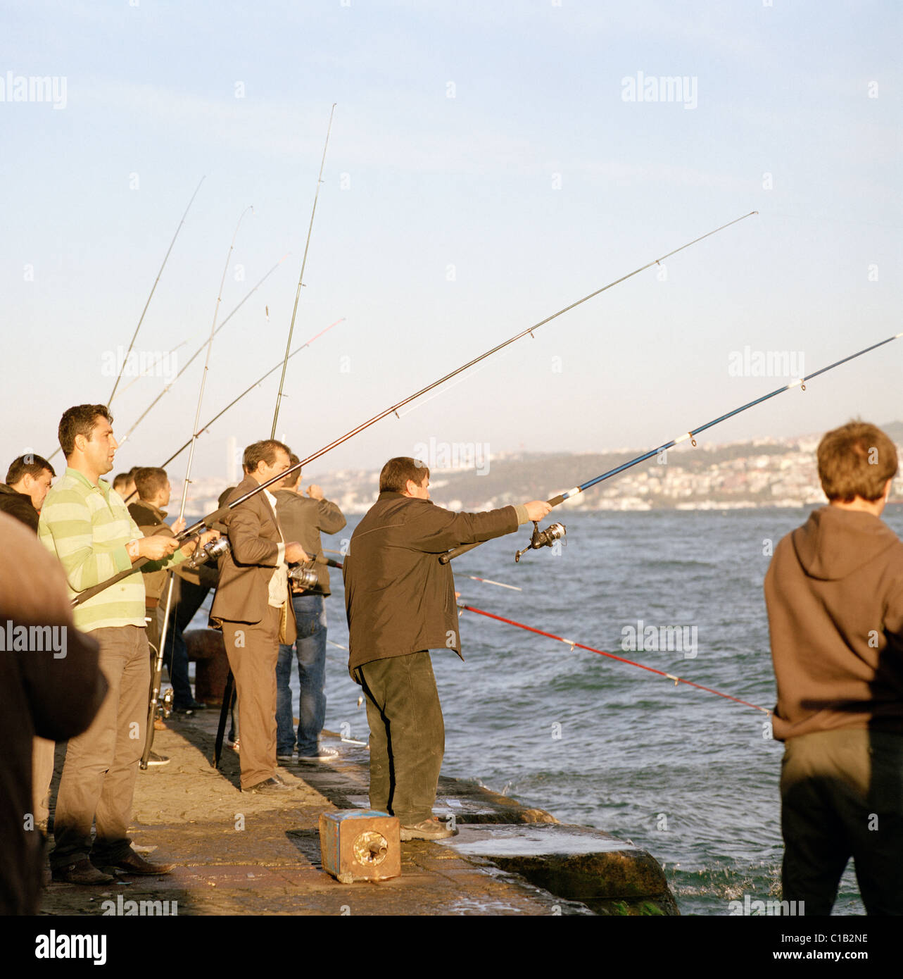 Men fishing the Bosphorus in Istanbul in Turkey in Middle East