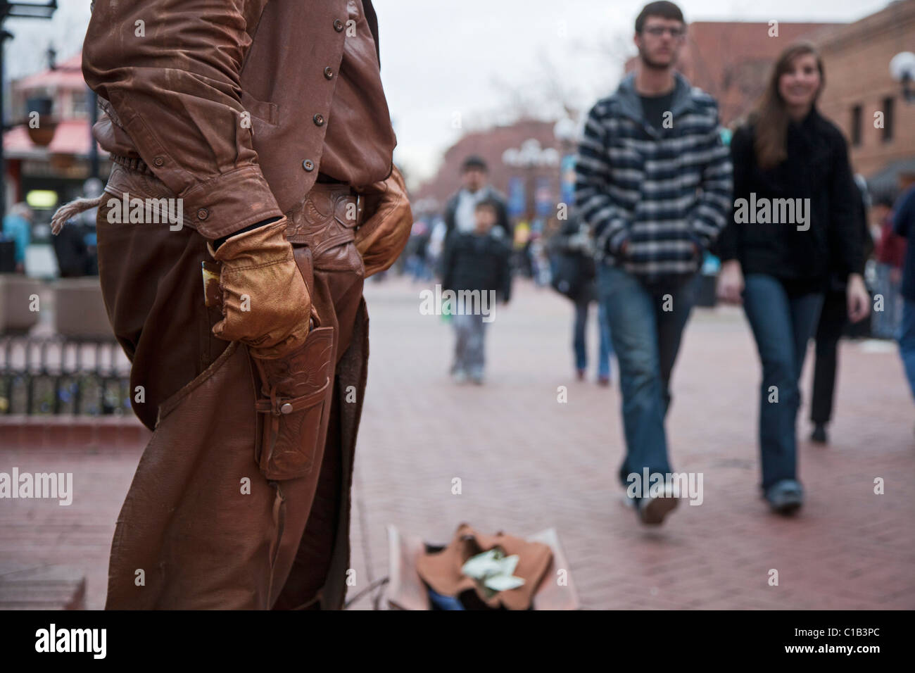 Boulder, Colorado - A street performer dressed as an old west gunslinger on the Pearl Street Mall Stock Photo