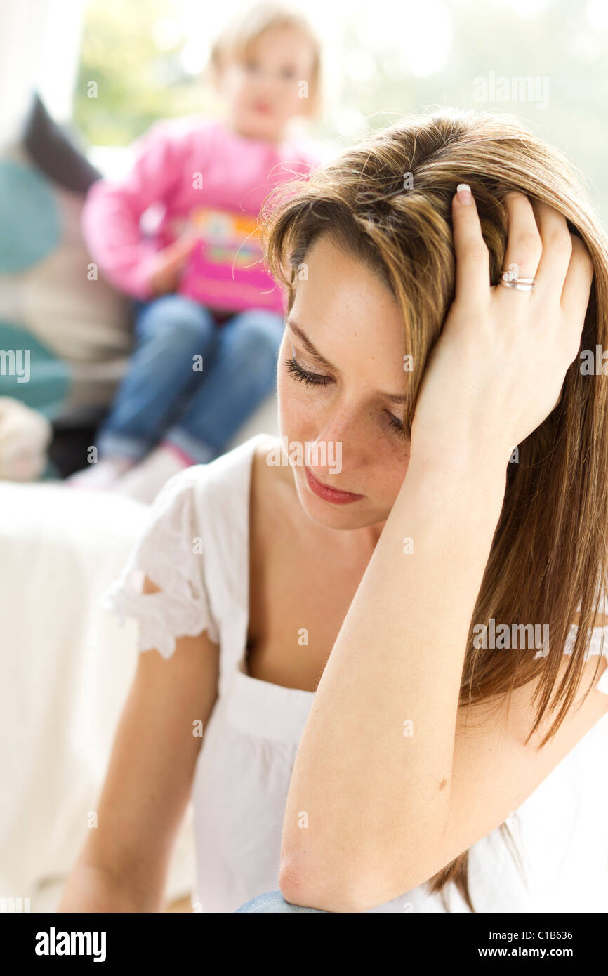 Stressed mother with child Stock Photo