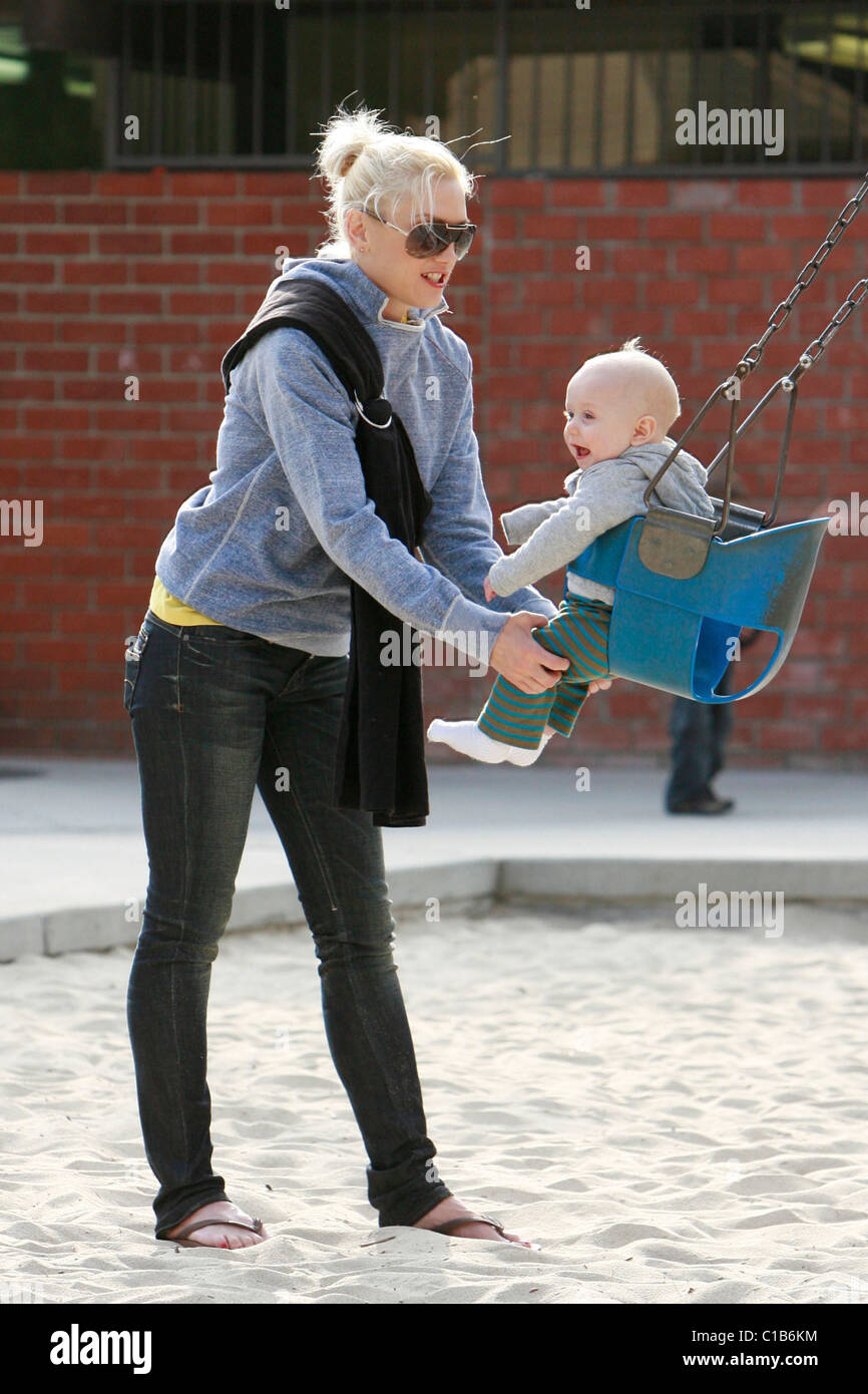 Gwen Stefani pushes baby Zuma in a swing as they spend the afternoon at(01)