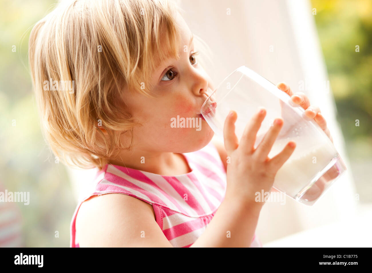 Child drinking glass of milk Stock Photo Alamy