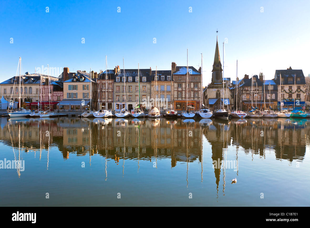 Honfleur harbour in Normandy, France. Old houses and their reflection ...