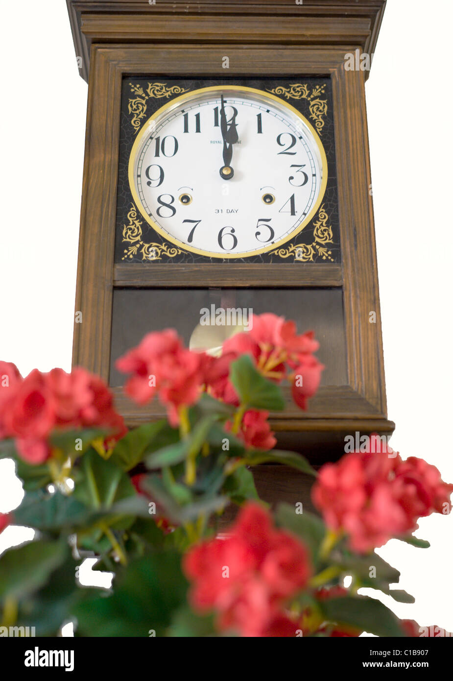 An old-fashioned pendulum clock slowly ticks the hours at the Shaffer Hotel in Mountainair, New Mexico. Stock Photo