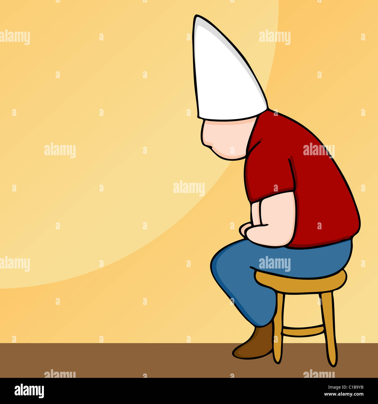 An image of a man wearing a dunce cap sitting on a stool. Stock Photo