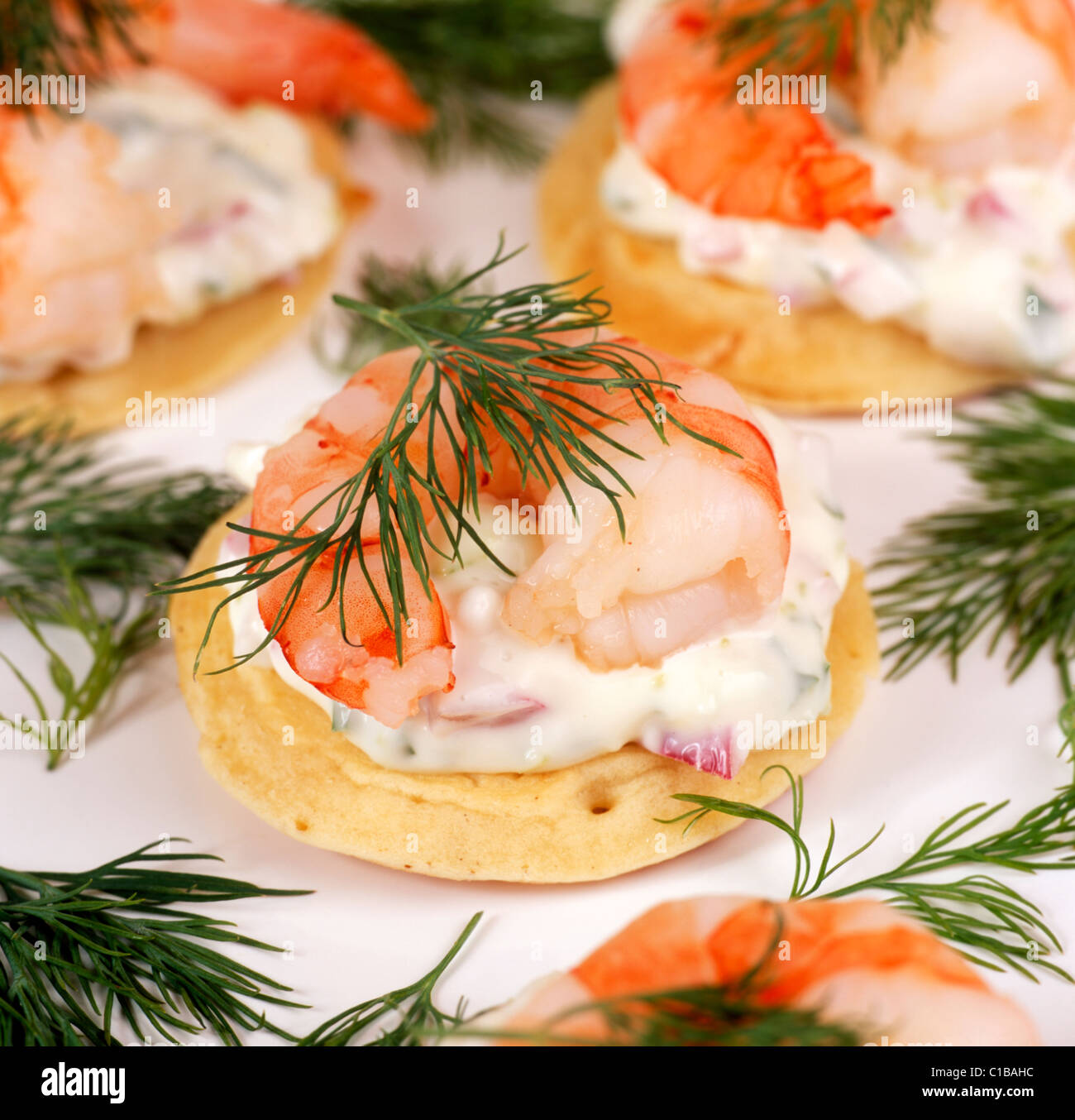 Tiger prawns & soured cream blinis Stock Photo Alamy