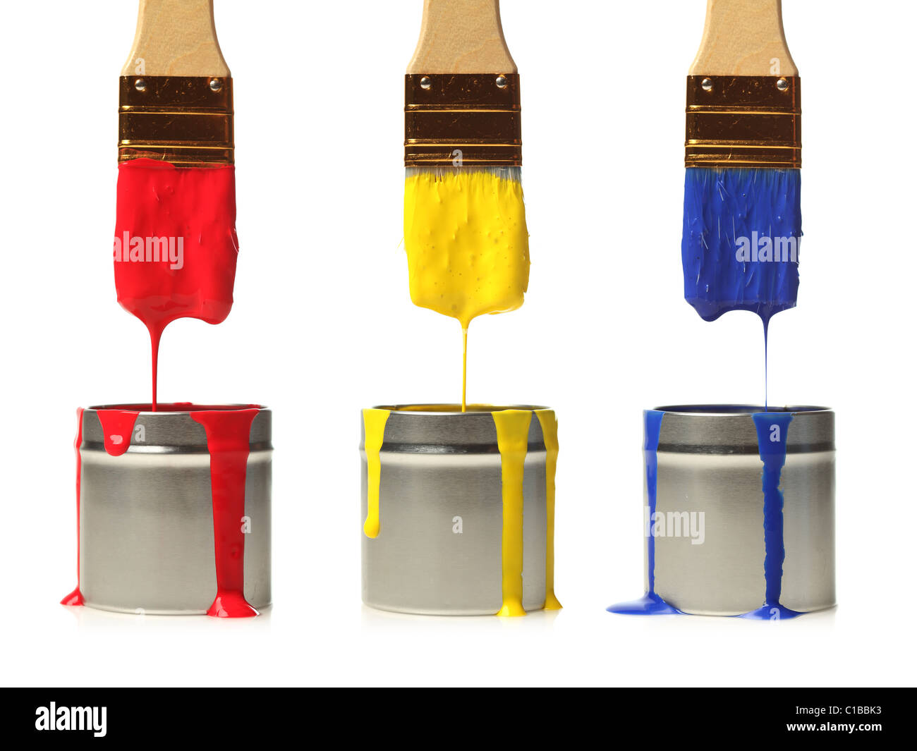 Paintbrushes dripping with paint Stock Photo