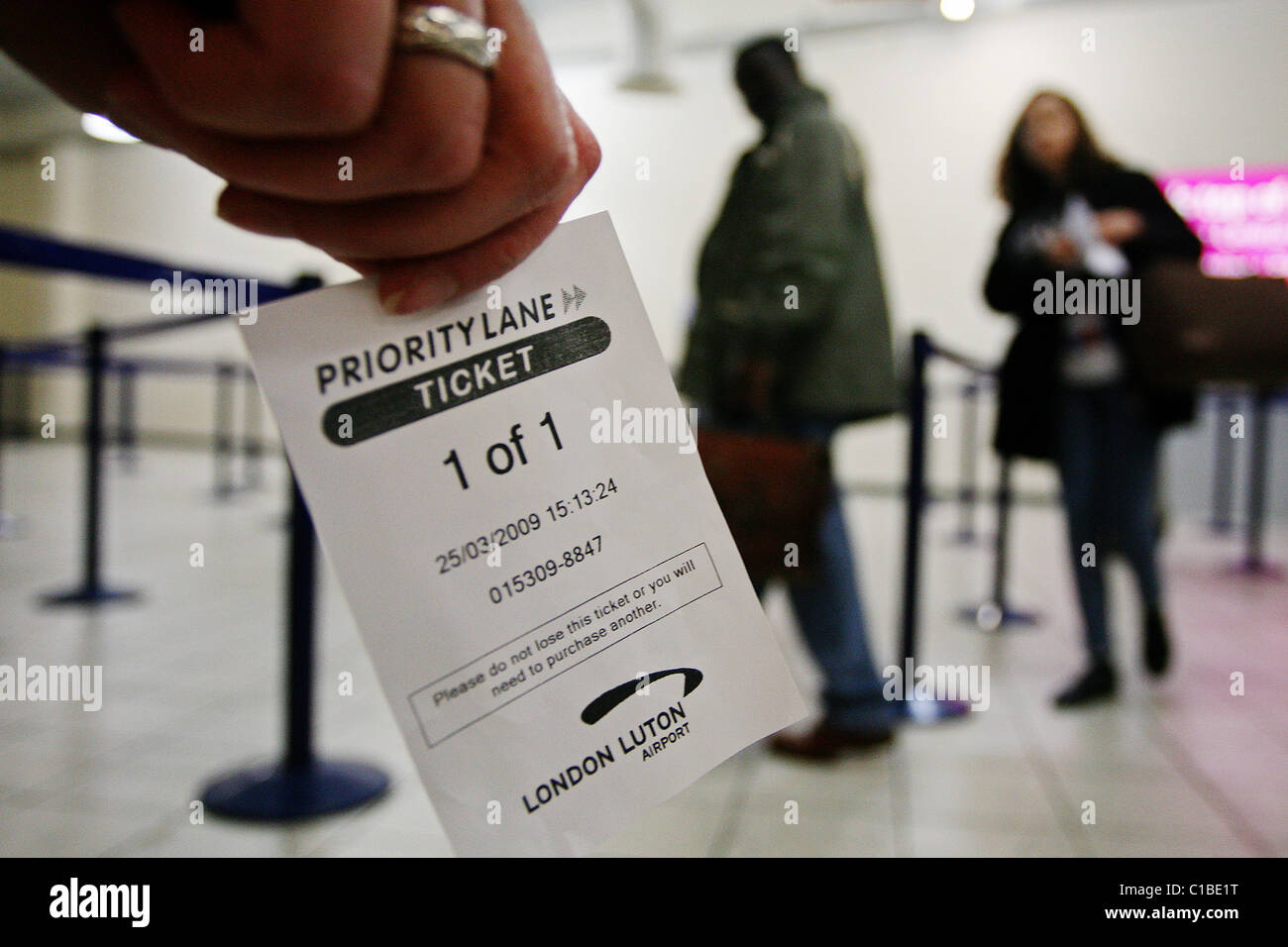 Luton London Airport's 'priority lane' for security. Passengers who buy a ticket can jump the security wait. Stock Photo