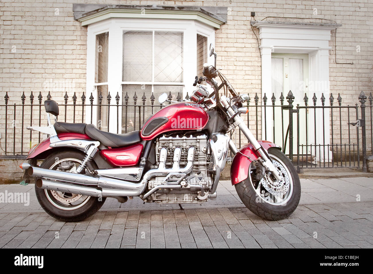 Triumph Motorbike Outside A House In England Stock Photo Alamy