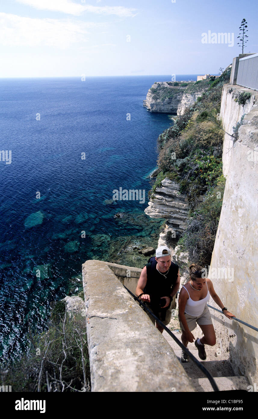 France, Corse du Sud, Bonifacio, tourists climbing the stairs of the king of Aragon (escalier du roi d'Aragon) Stock Photo