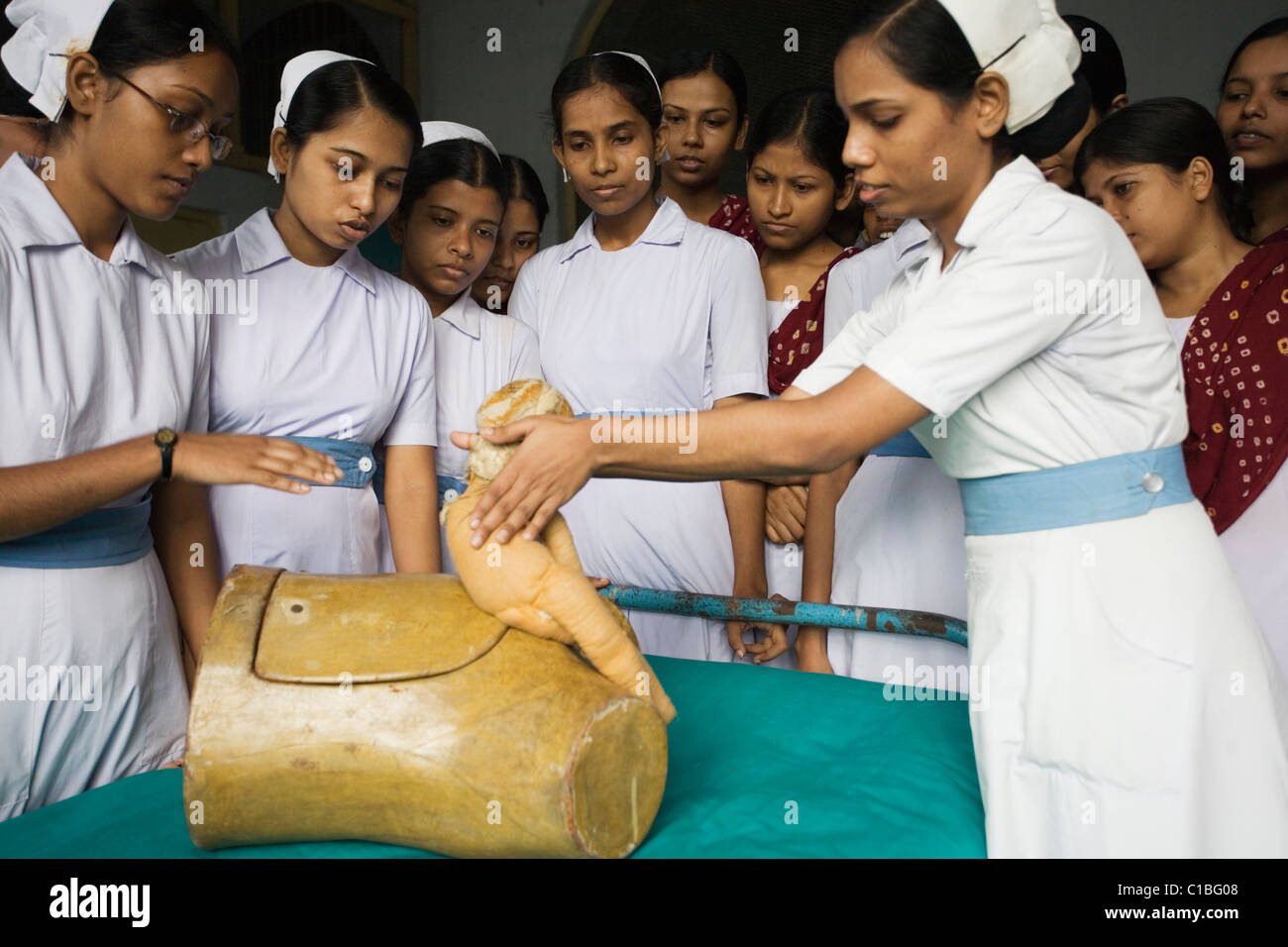 Trainee midwives at Kolkata Nursing College demonstrating childbirth, Kolkata, India Stock Photo