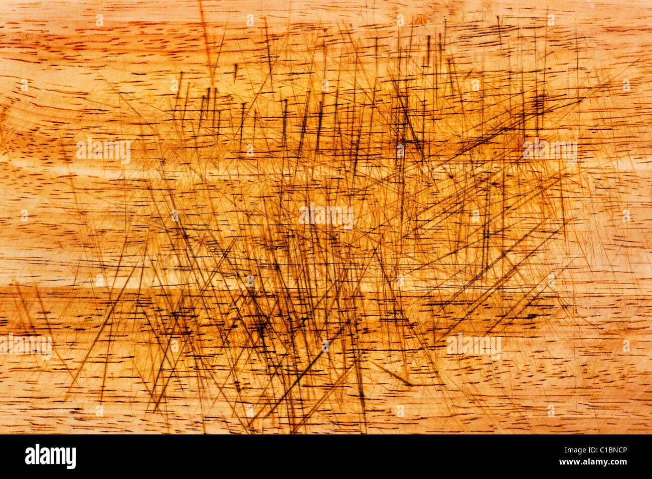 Texture of a severely scarred wood chopping board Stock Photo
