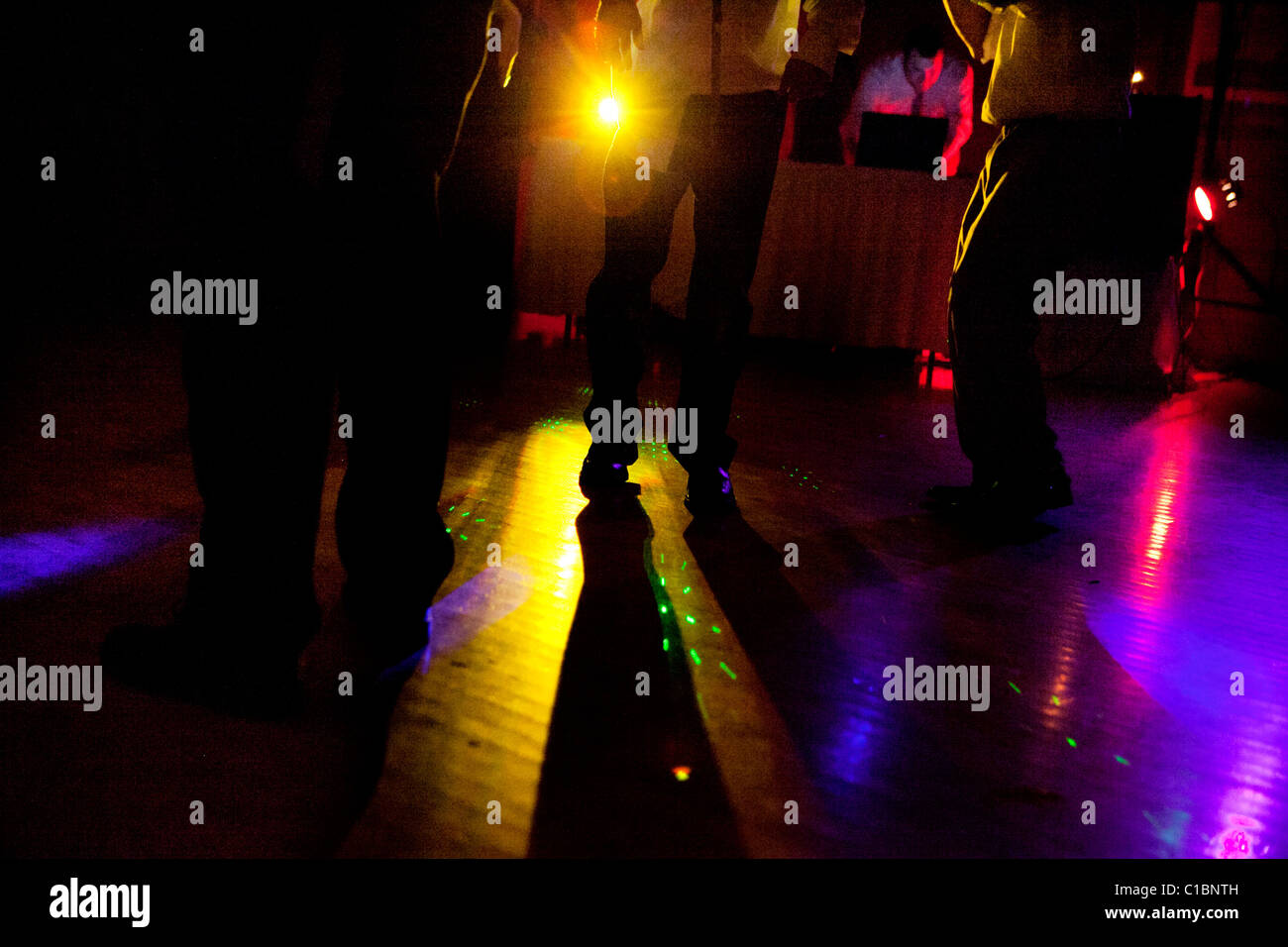 PEOPLE DANCING NIGHT DISCO LIGHTS COLOR Stock Photo