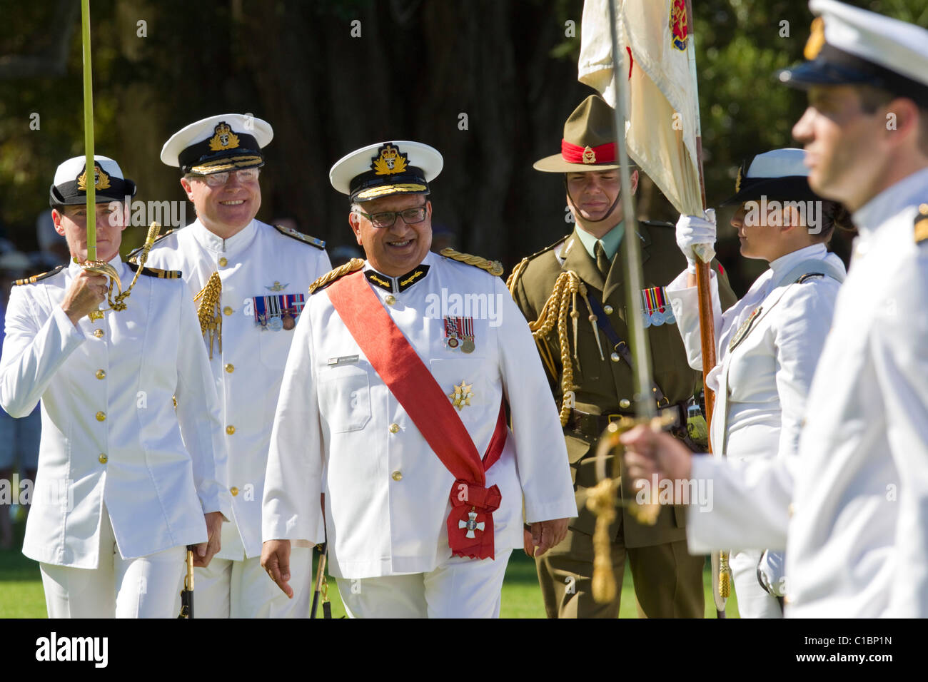 The Governor-General, Rt Hon Sir Anand Satyanand inspects the Royal New Zealand Navy performing a beating retreat sunset ceremon Stock Photo