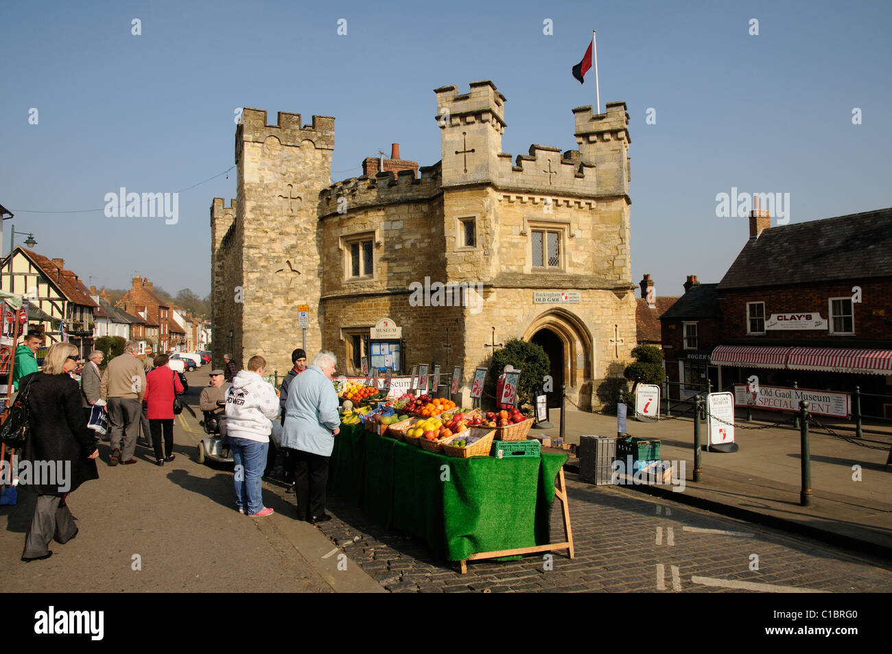 Selling fresh fruit & vegetables outside the Old Gaol in Buckingham Buckinghamshire England UK Stock Photo