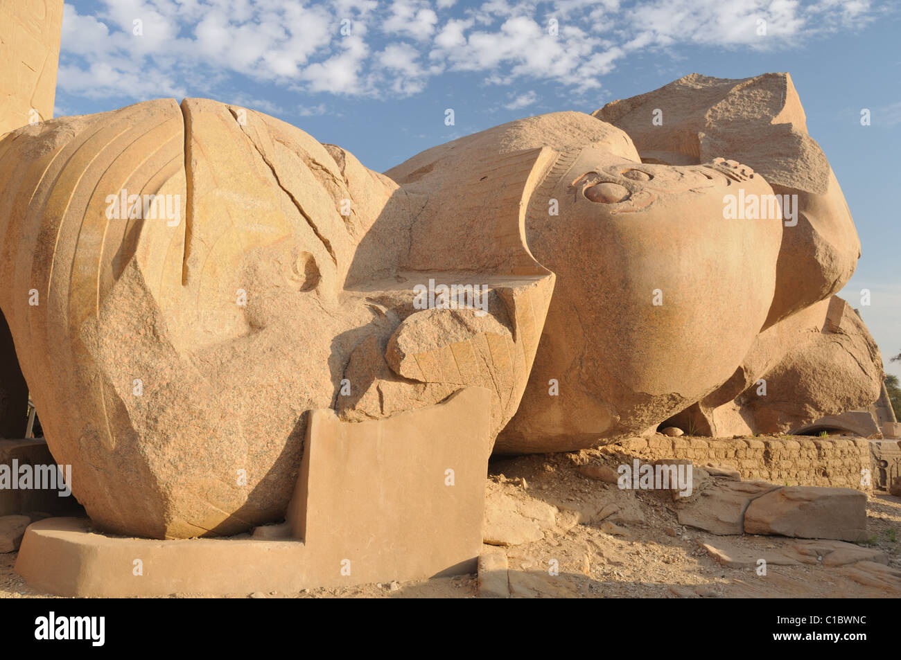 Huge fallen statues of Ramses II in the Ramesseum at Thebes, Egypt. One