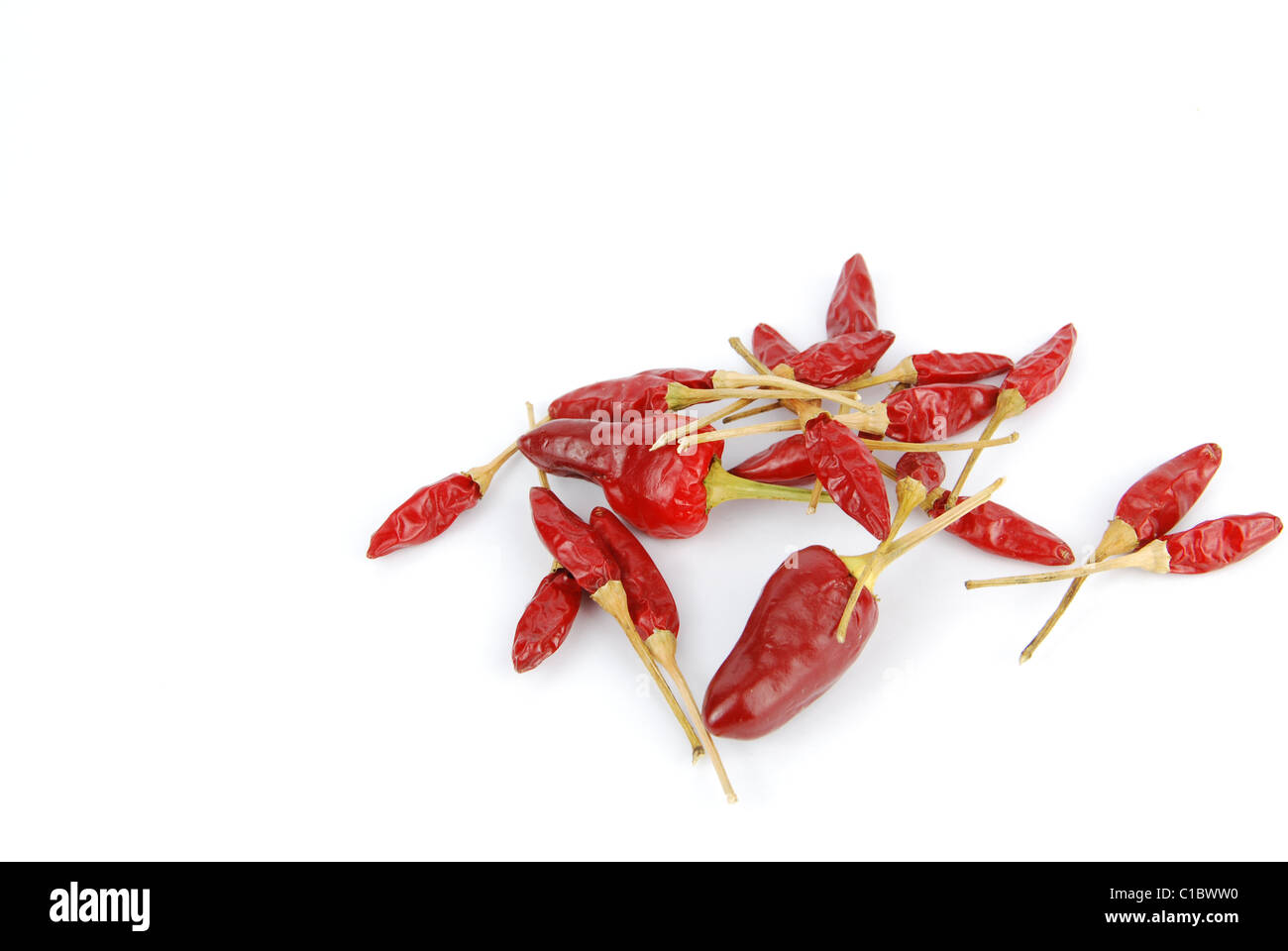 red chili peppers isolated on white background Stock Photo - Alamy