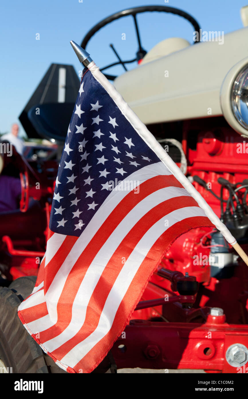 Old Ford tractor with American flag. Stock Photo