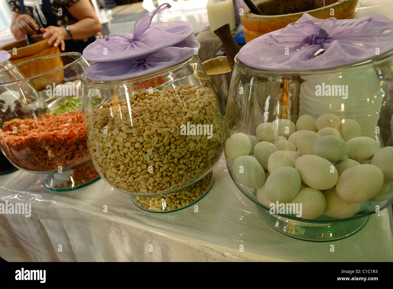 ingredients for papaya salad (somtum) in glass jars , thai speciality cuisine, bangkok, thailand Stock Photo
