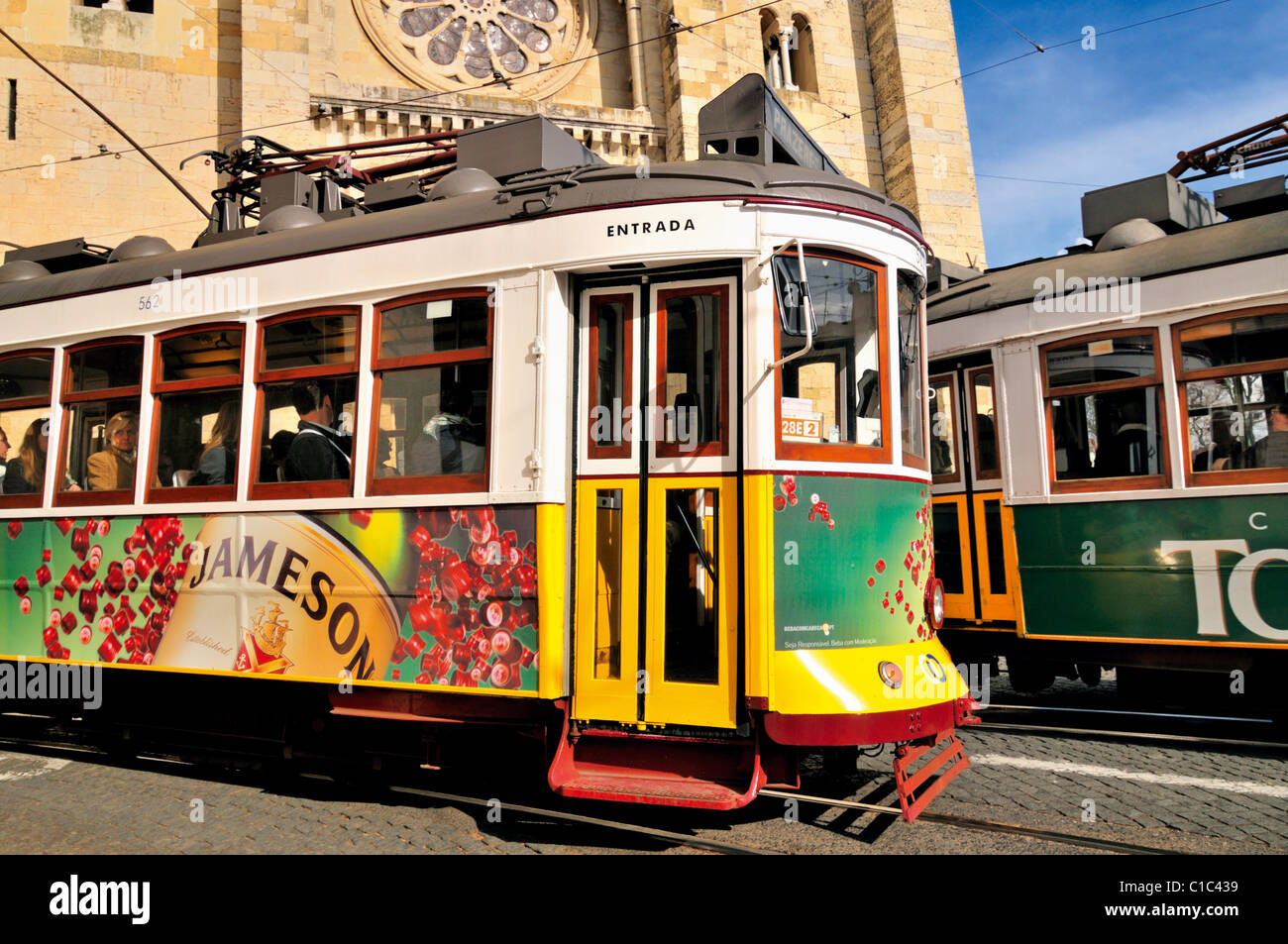 Portugal, Lisbon: Historic Trams passing the Cathedral 'Sé Catedral' Stock Photo
