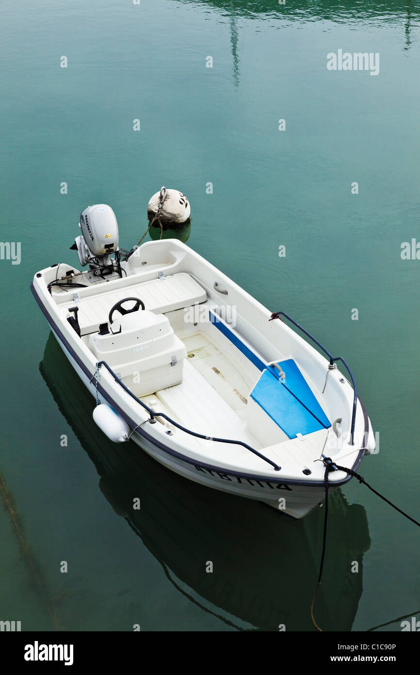 Small motor boat moored Stock Photo