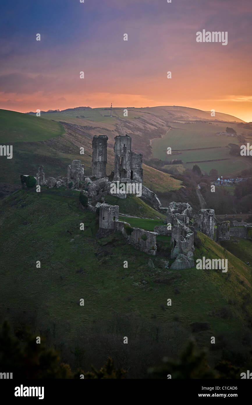 Corfe Castle in the Purbeck Hills photographed early during a winter's morning sunrise Stock Photo