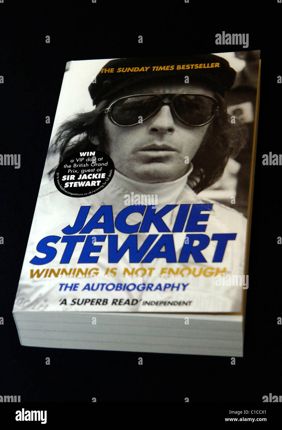 jackie-stewart-signs-copies-autobiography-hi-res-stock-photography-and